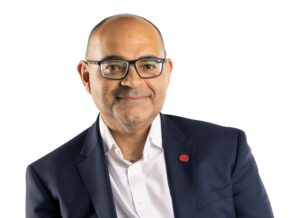 Headshot of Johnson Idesoh, Group Chief Information and Technology Officer.